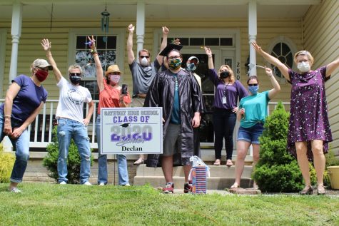 Staff celebrate with graduate and staff writer, Declan Browning, in front of his home.