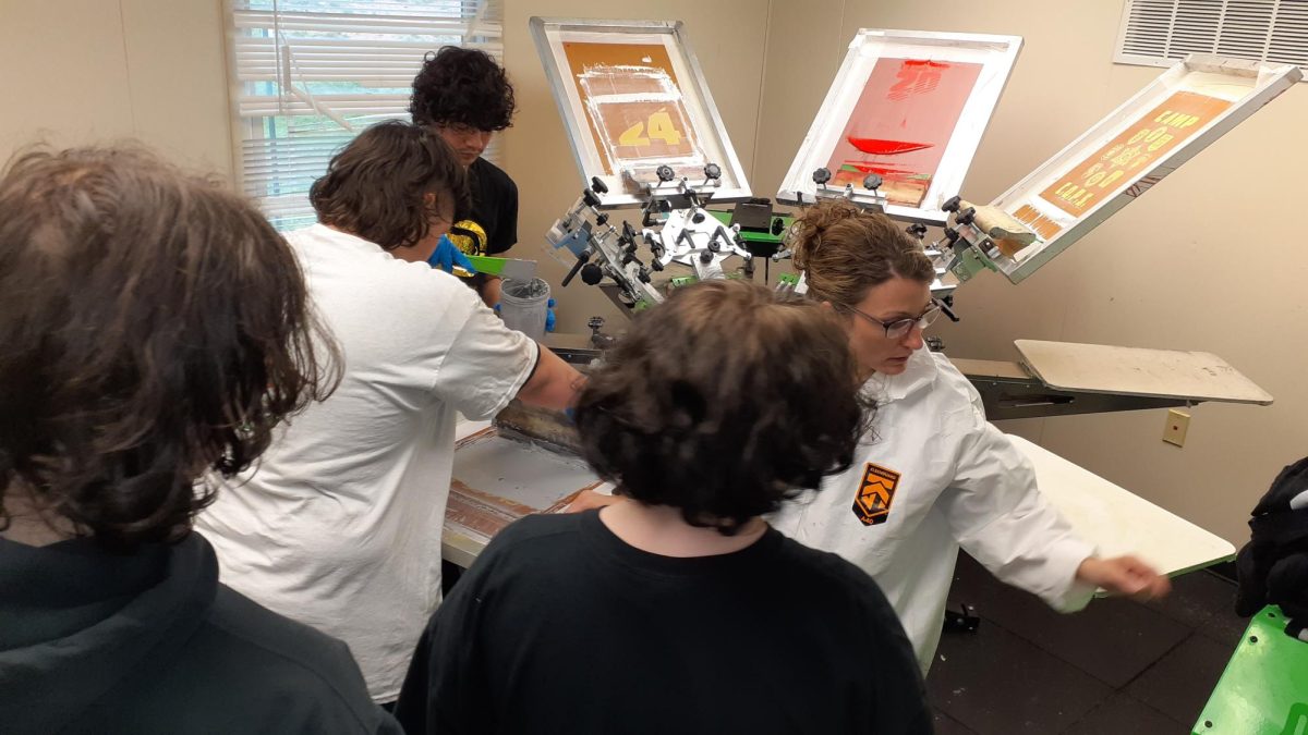 The screen printing class is hard at work creating t-shirts. 